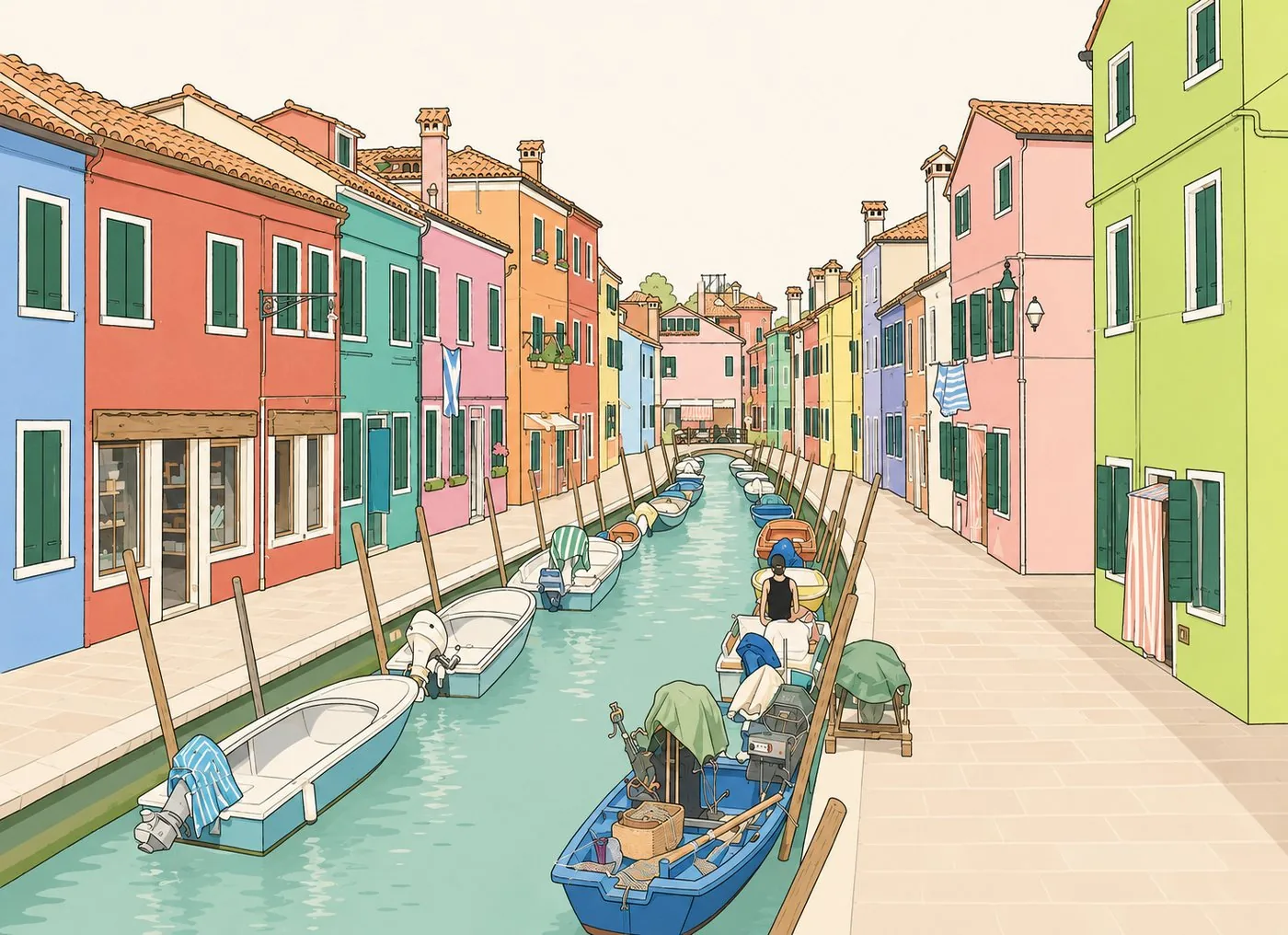 A canal on Burano lined with painted houses and moored boats